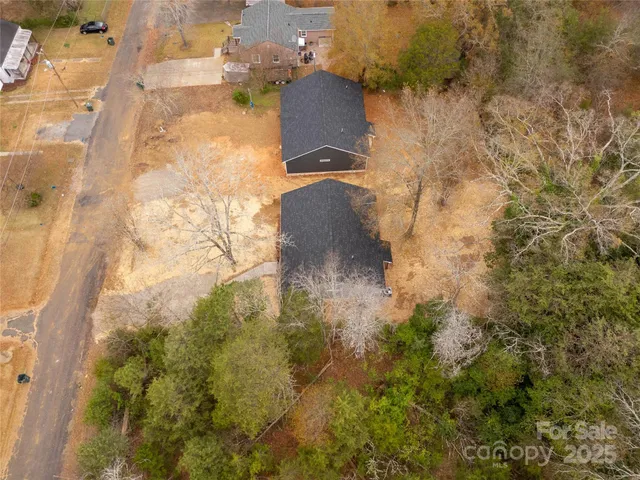 an aerial view of residential house with outdoor space