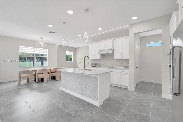 a bedroom with a bed and a ceiling fan