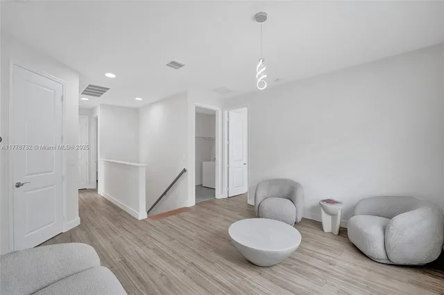 a view of a park with swings and slides