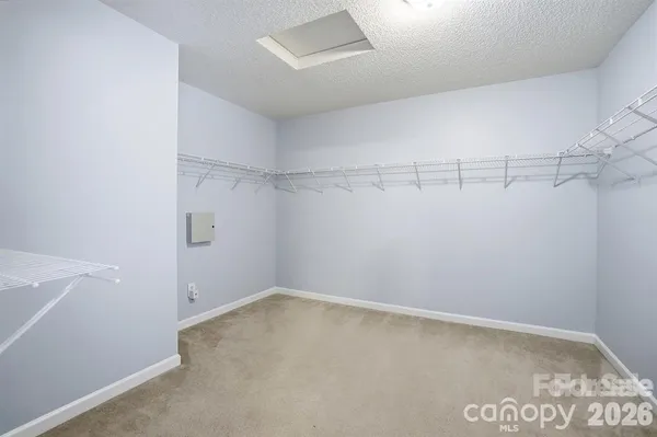a view of a room with racks on the wall