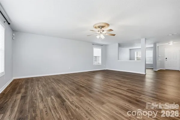 a view of kitchen with wooden floor and window