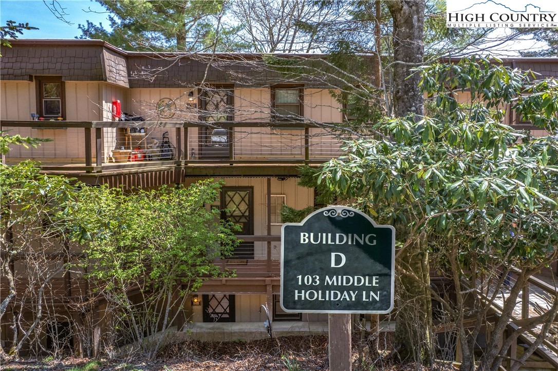 103 Mid Holiday Lane, Unit 115D Beech Mountain, NC 28604 - Photo 20 of 25 a sign on the side of a building
