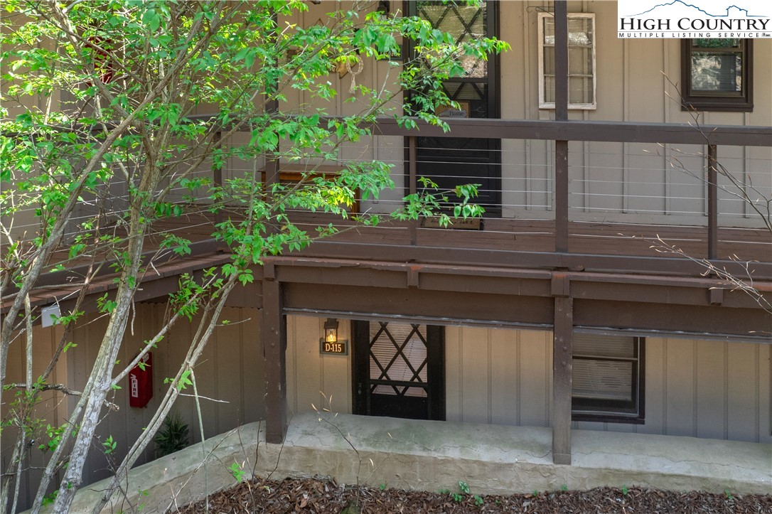 103 Mid Holiday Lane, Unit 115D Beech Mountain, NC 28604 - Photo 2 of 25 a house with trees in front of it