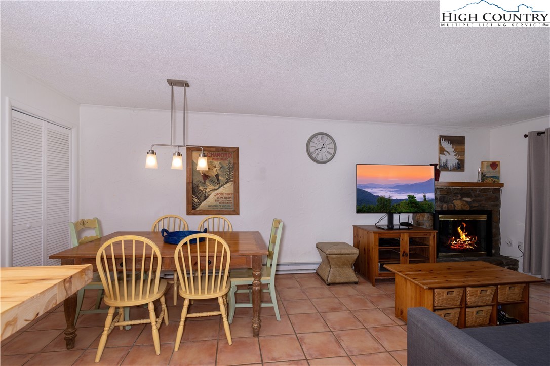 103 Mid Holiday Lane, Unit 115D Beech Mountain, NC 28604 - Photo 6 of 25 a view of a dining room with furniture