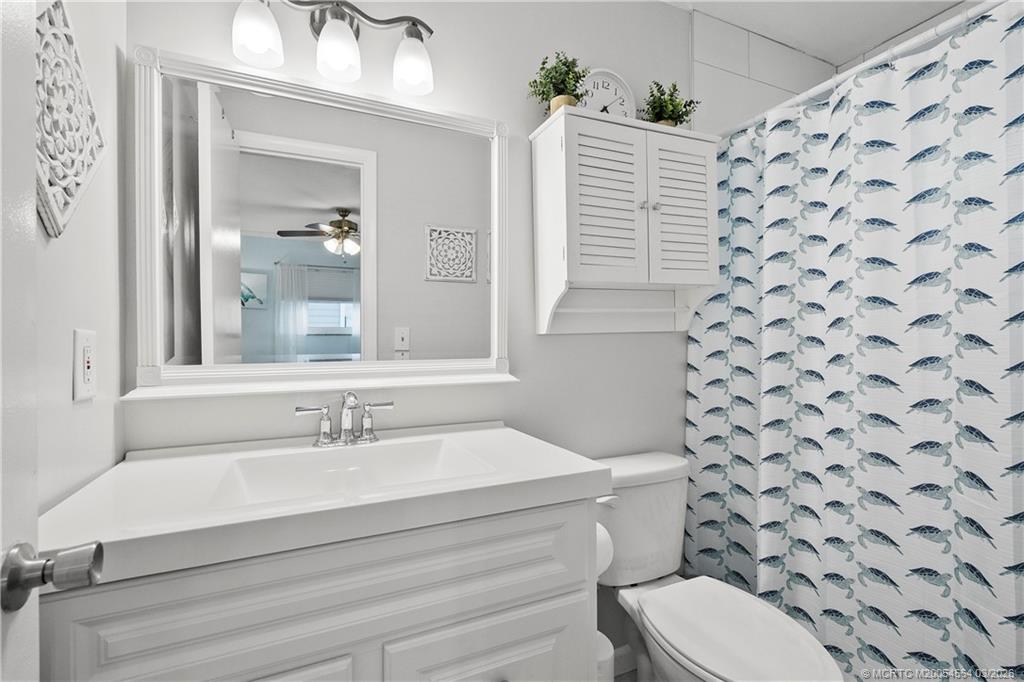 2602 Southeast Jackson Street Stuart, FL 34997 - Photo 23 of 53 a bathroom with a sink toilet and shower