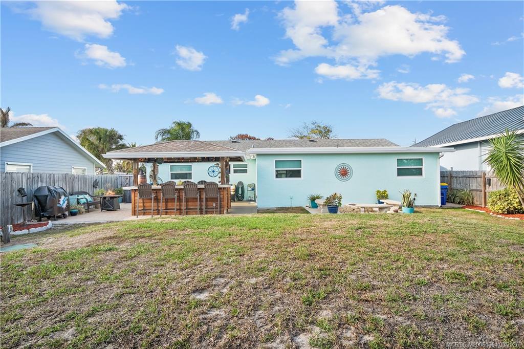 2602 Southeast Jackson Street Stuart, FL 34997 - Photo 40 of 53 a front view of house with yard and entertaining space