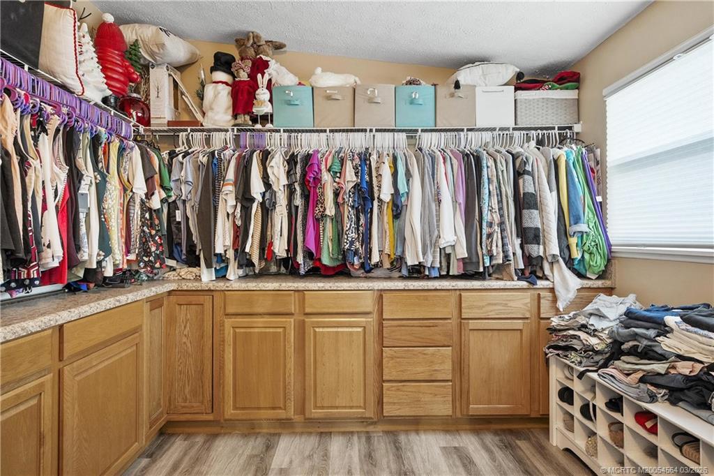 2602 Southeast Jackson Street Stuart, FL 34997 - Photo 52 of 53 a view of walk in closet with clothes