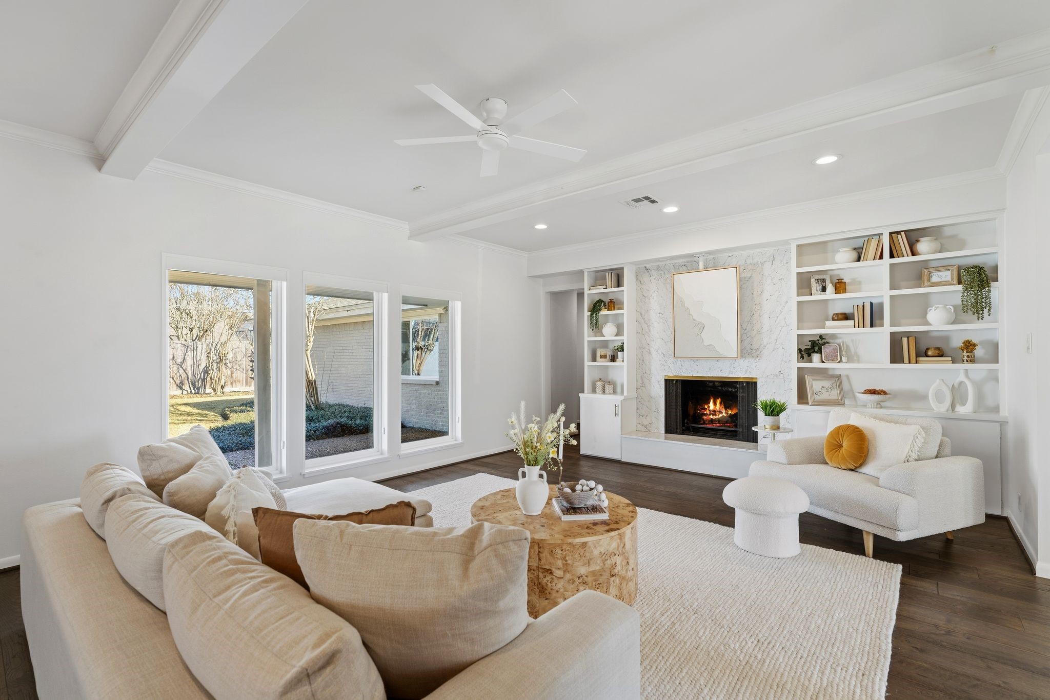 5706 Ariel Street Houston, TX 77096 - Photo 11 of 31 Light-filled living room with original marble details, lovely built-ins, and thoughtful updates that honor the home’s character.