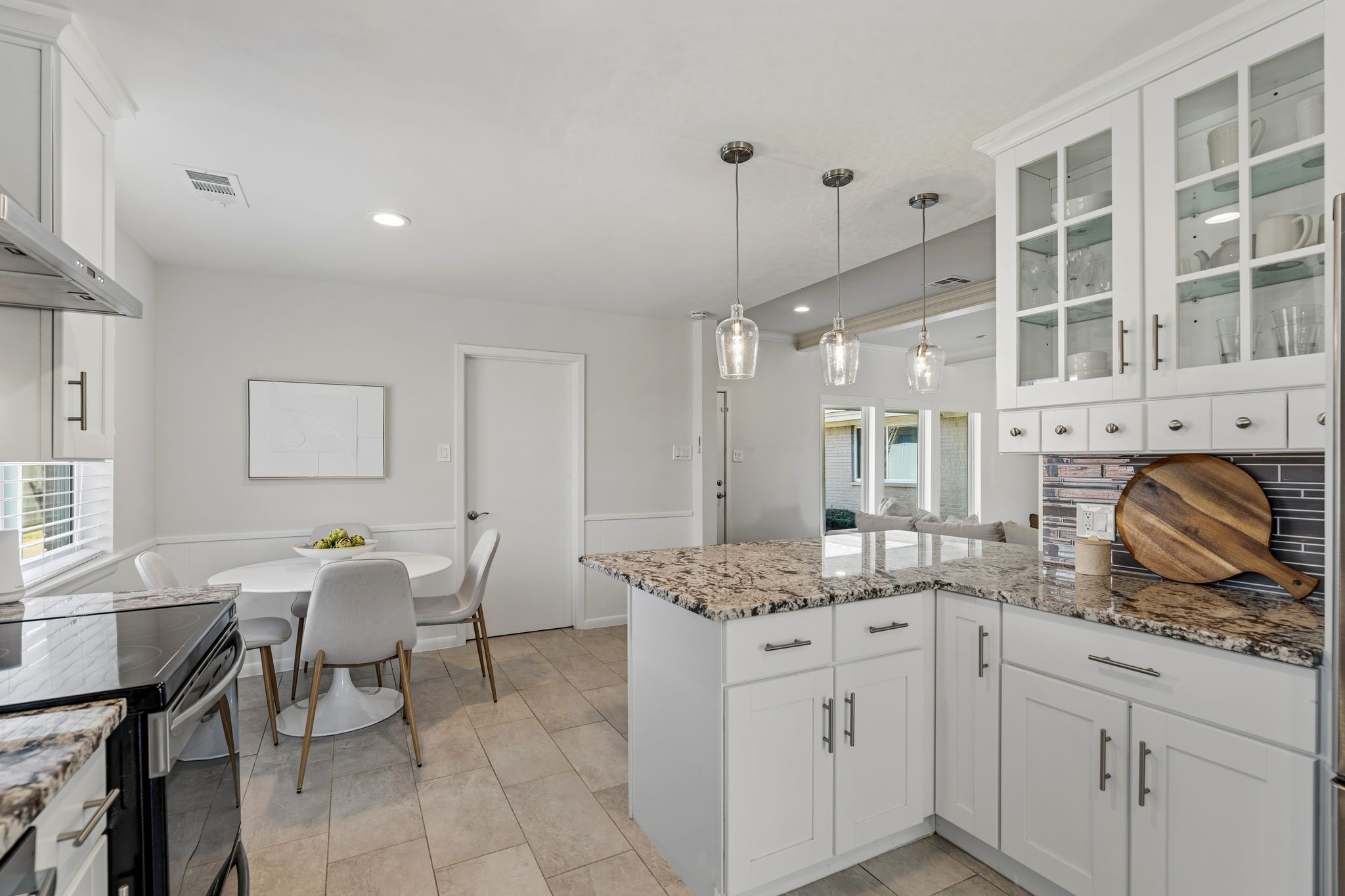 5706 Ariel Street Houston, TX 77096 - Photo 9 of 31 *Utility room is just beyond that door behind the breakfast nook. Also connects to breezeway.