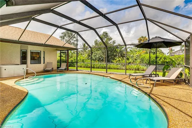 a view of swimming pool with a patio