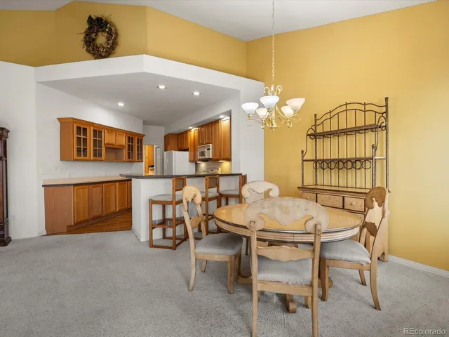 a dinning room with a table and chairs