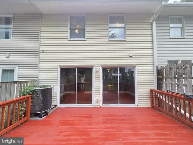 a view of a house with porch and wooden floor