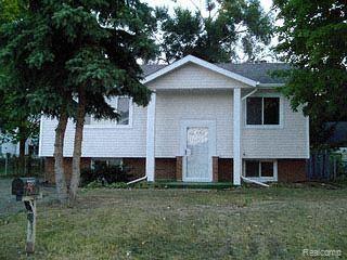 1047 West Hemphill Road Flint, MI 48507 - Photo 1 of 1 Front
