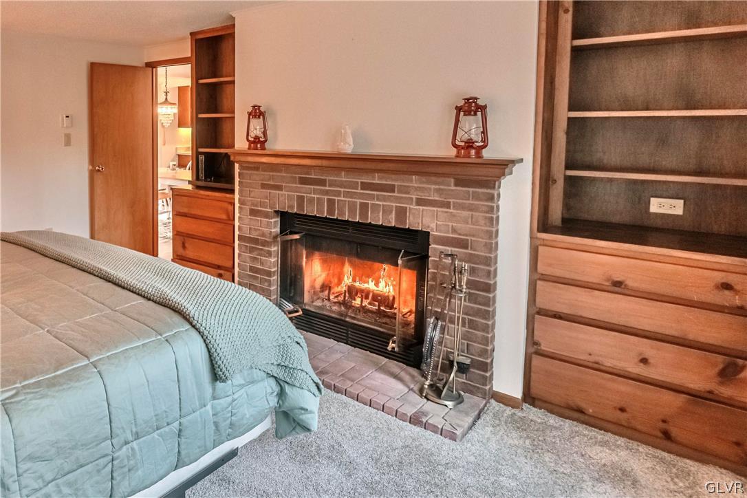 419 Merwinsburg Road Effort, PA 18330 - Photo 12 of 32 a bedroom with a fireplace and a fireplace