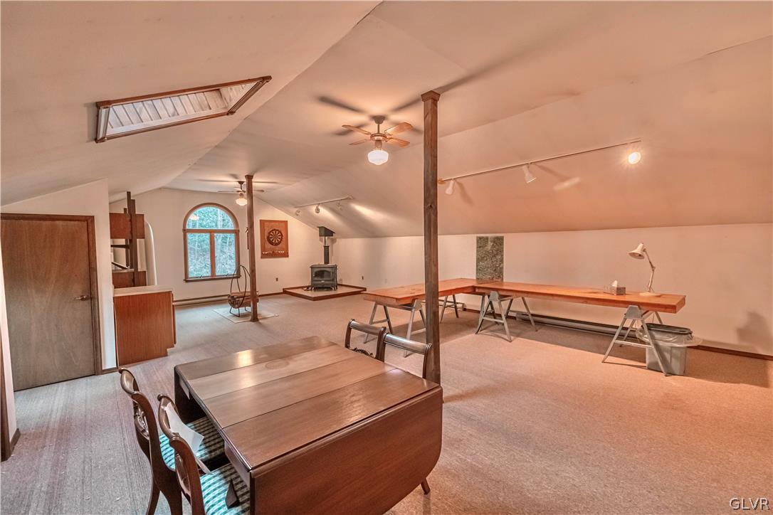 419 Merwinsburg Road Effort, PA 18330 - Photo 20 of 32 a living room with furniture a flat screen tv and a table