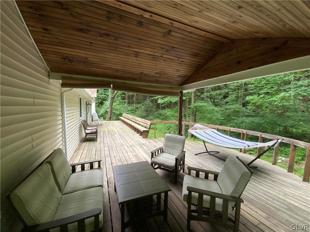 419 Merwinsburg Road Effort, PA 18330 - Photo 31 of 32 a view of a patio with a table chairs and a backyard