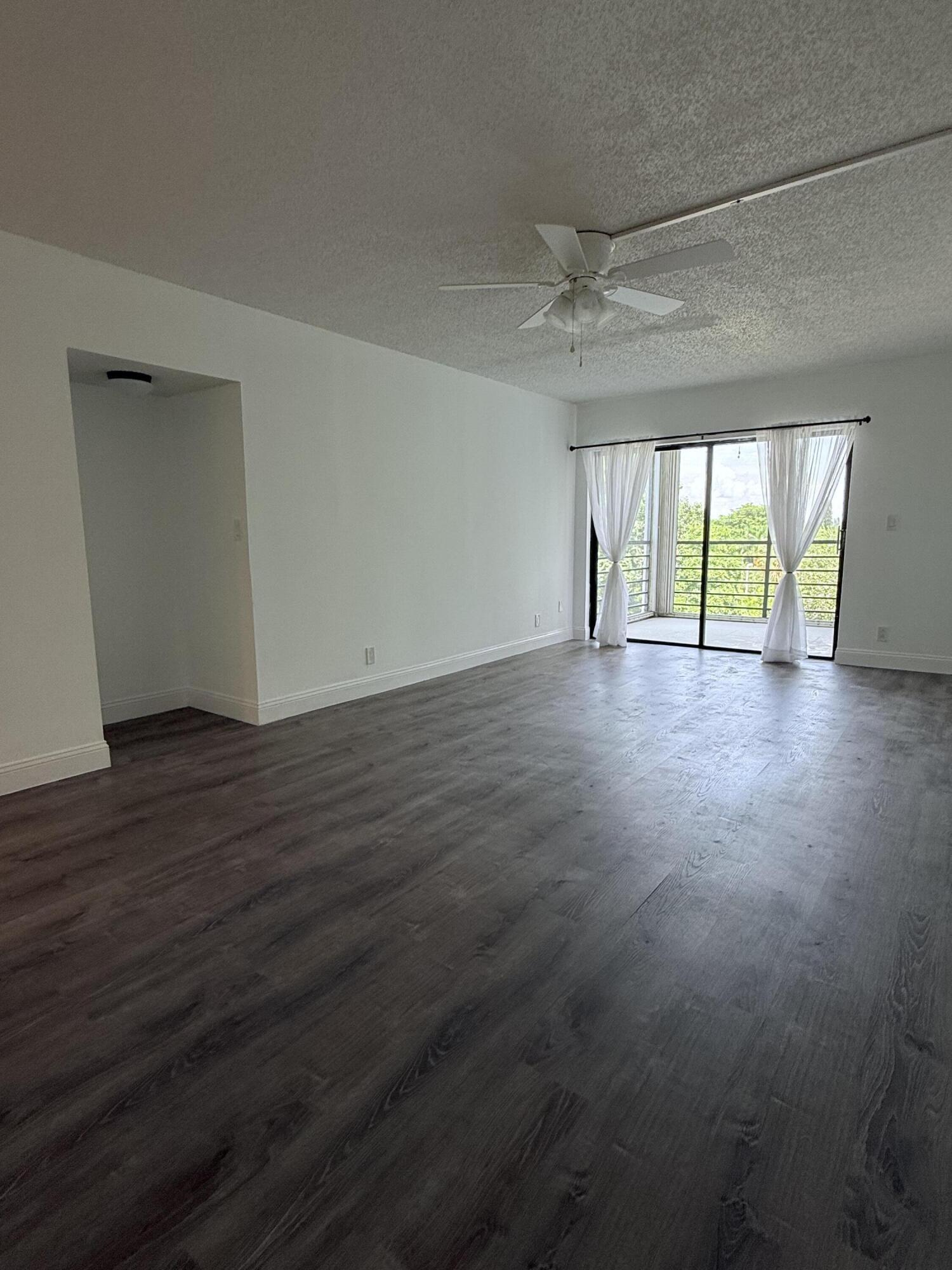 9235 Southwest 8th Street, Unit 507 Boca Raton, FL 33428 - Photo 6 of 24 Dining/Living Room