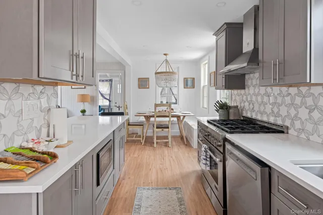 a kitchen with stainless steel appliances granite countertop a stove and a sink