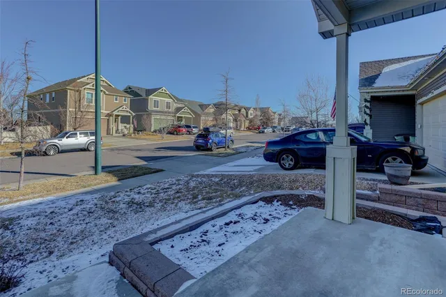 a view of a car park in front of house