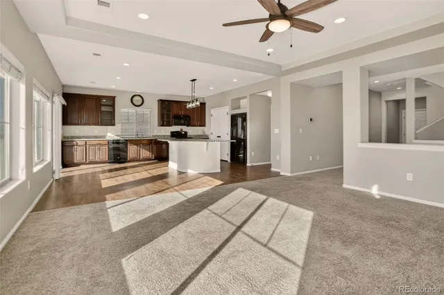 a bathroom with a granite countertop sink and a large mirror