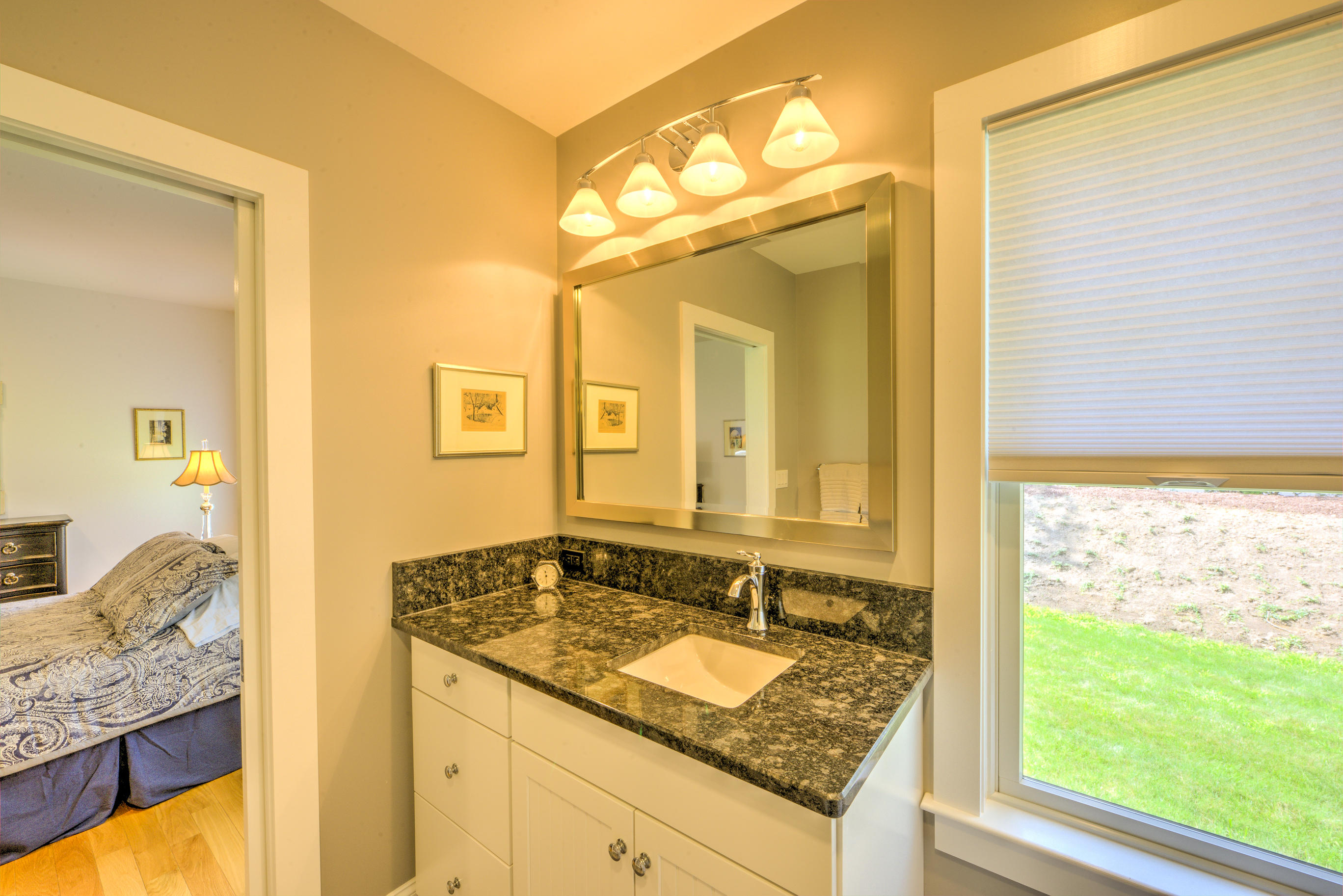 63 Joyce Anne Road Centerville, MA 02632 - Photo 23 of 35 a bathroom with a granite countertop sink and a mirror