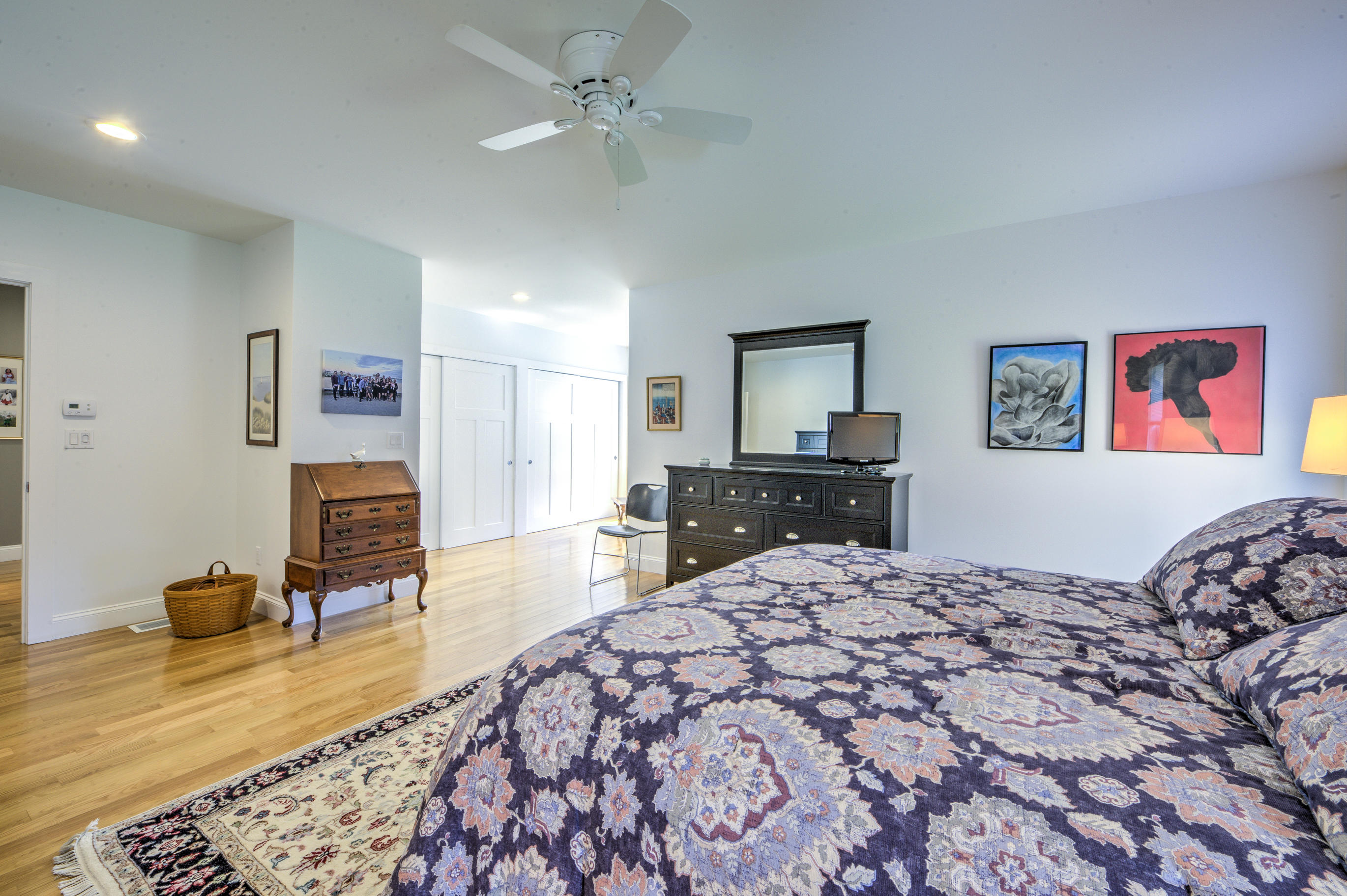 63 Joyce Anne Road Centerville, MA 02632 - Photo 26 of 35 a bed room with a bed and a chandelier