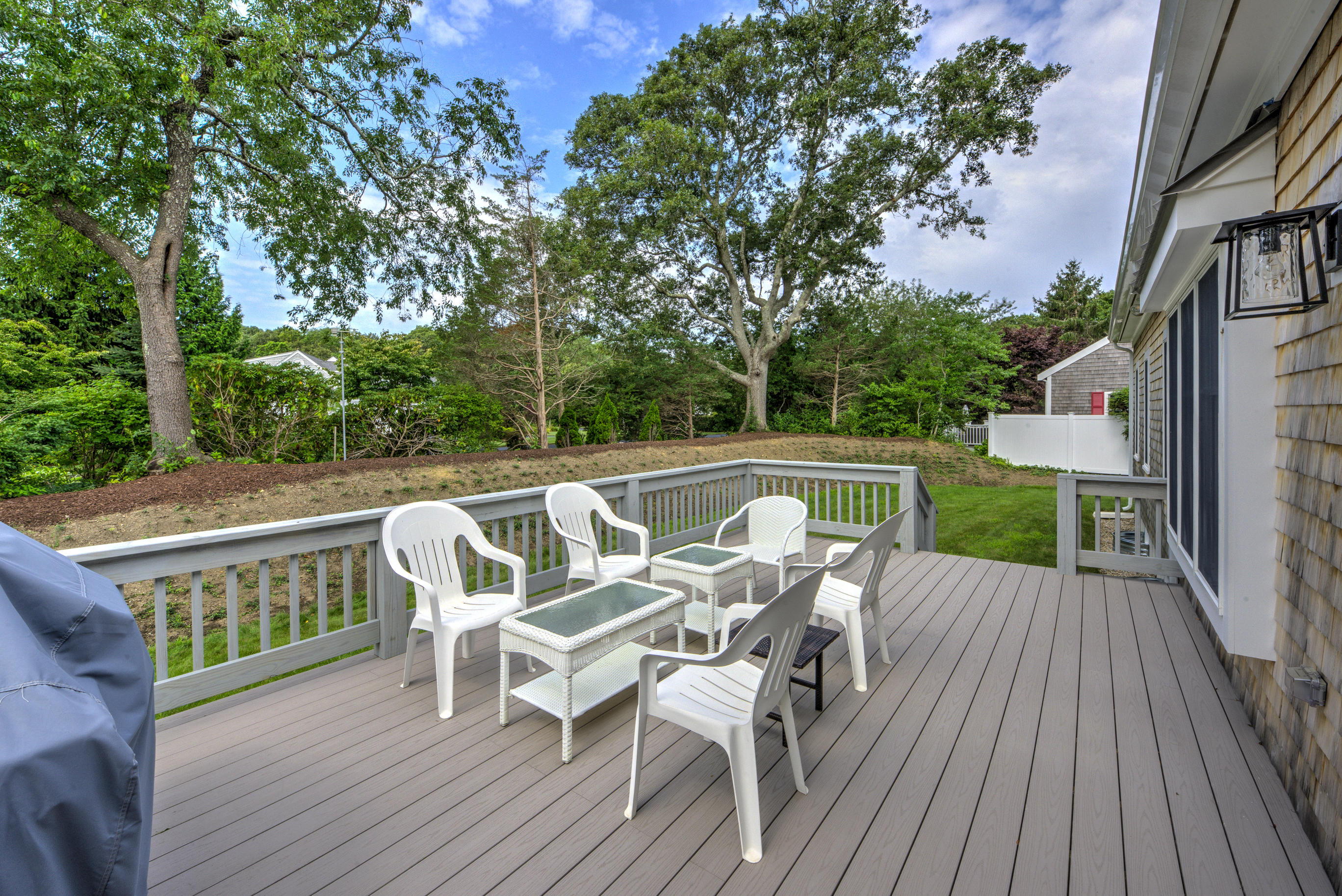 63 Joyce Anne Road Centerville, MA 02632 - Photo 5 of 35 a view of a deck with furniture and a deck