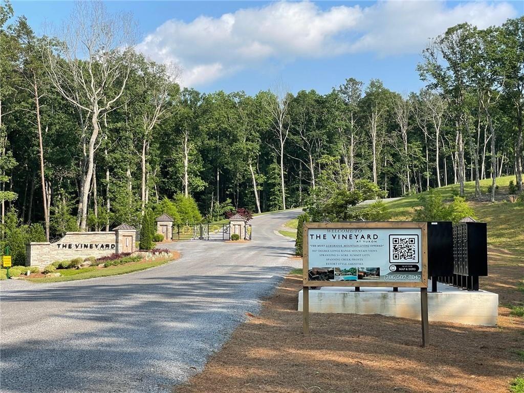 135 Twisted Oak Road Talking Rock, GA 30175 - Photo 14 of 27 a view of a park with iron fence
