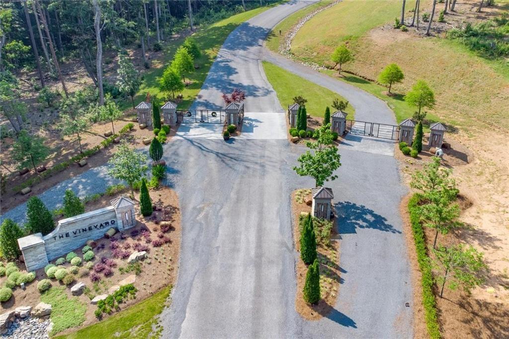 135 Twisted Oak Road Talking Rock, GA 30175 - Photo 19 of 27 an aerial view of a house with a yard and garden