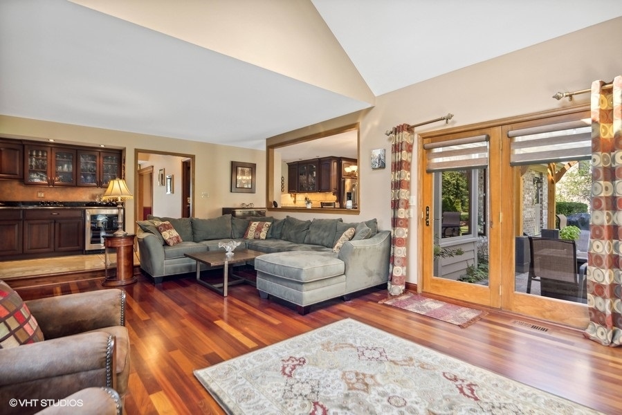 467 81st Street Burr Ridge, IL 60527 - Photo 11 of 45 a living room with furniture wooden floor and a fireplace