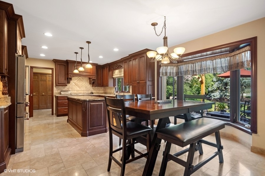 467 81st Street Burr Ridge, IL 60527 - Photo 16 of 45 a view of a dining room with furniture window and outside view