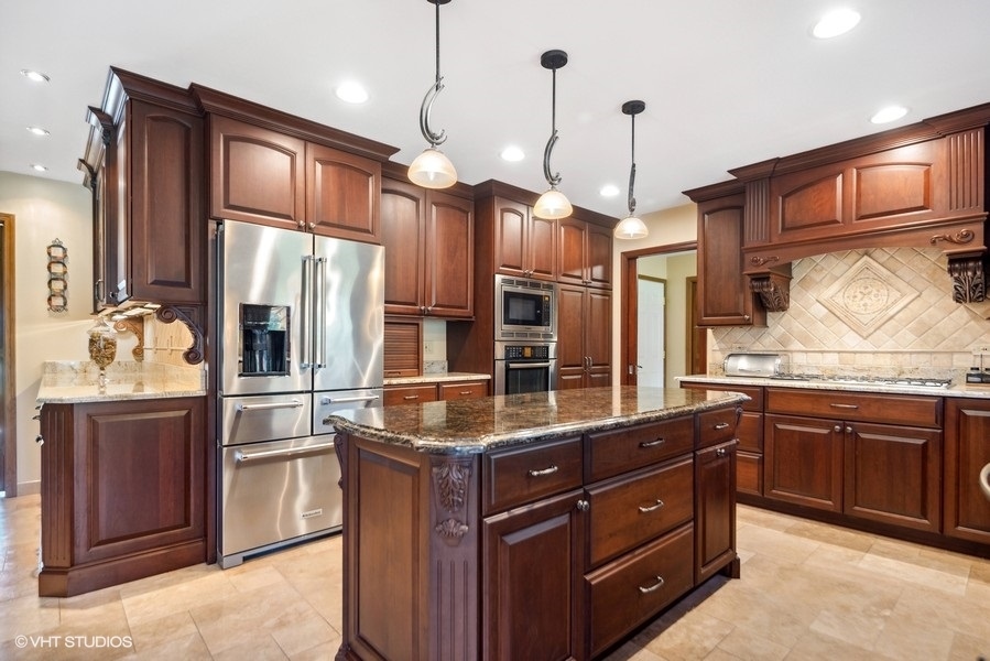 467 81st Street Burr Ridge, IL 60527 - Photo 17 of 45 a kitchen with stainless steel appliances granite countertop a refrigerator a oven and a sink with large cabinets