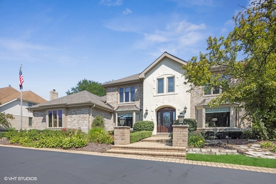 467 81st Street Burr Ridge, IL 60527 - Photo 2 of 45 a front view of a house with garden