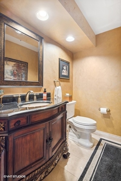 467 81st Street Burr Ridge, IL 60527 - Photo 24 of 45 a bathroom with a granite countertop toilet sink and mirror