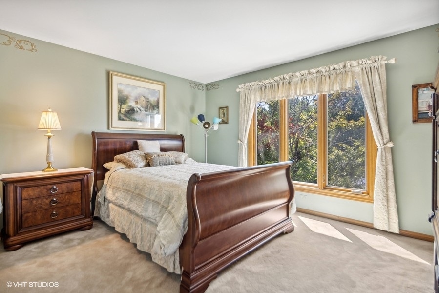 467 81st Street Burr Ridge, IL 60527 - Photo 26 of 45 a bedroom with a bed and a painting on the wall