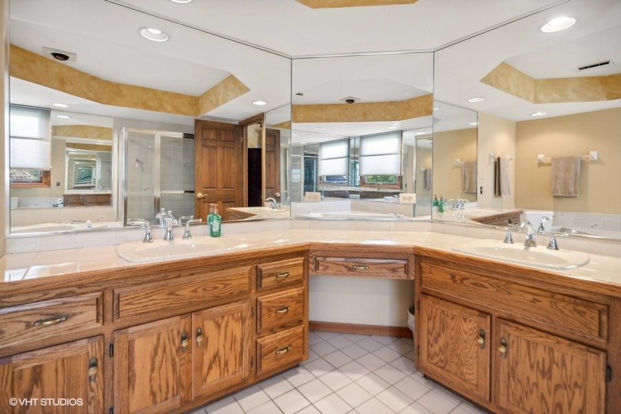 467 81st Street Burr Ridge, IL 60527 - Photo 32 of 45 a bathroom with a sink vanity and mirror