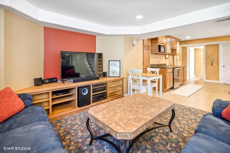 467 81st Street Burr Ridge, IL 60527 - Photo 35 of 45 a living room with furniture and a flat screen tv
