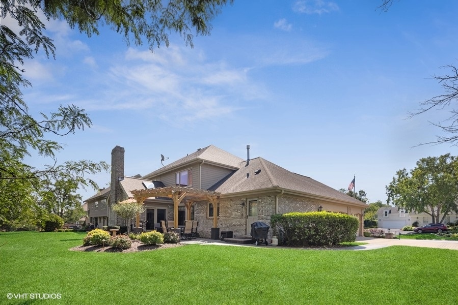 467 81st Street Burr Ridge, IL 60527 - Photo 43 of 45 a front view of a house with a garden and plants