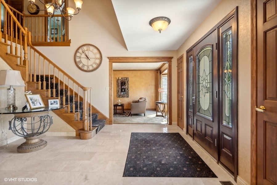 467 81st Street Burr Ridge, IL 60527 - Photo 7 of 45 a view of a hallway with wooden floor and entryway