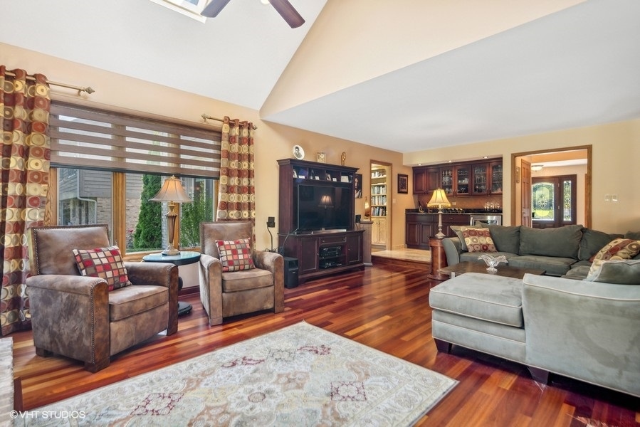 467 81st Street Burr Ridge, IL 60527 - Photo 10 of 45 a living room with furniture and a flat screen tv