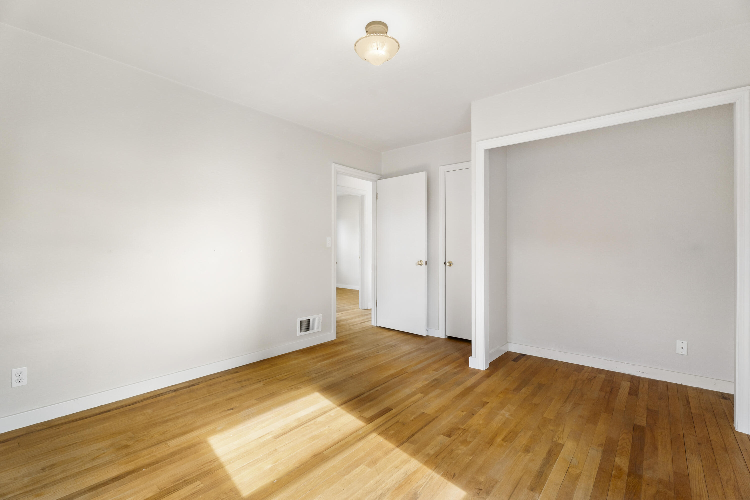 946 Southwest 13th Street Redmond, OR 97756 - Photo 29 of 49 a view of empty room with wooden floor