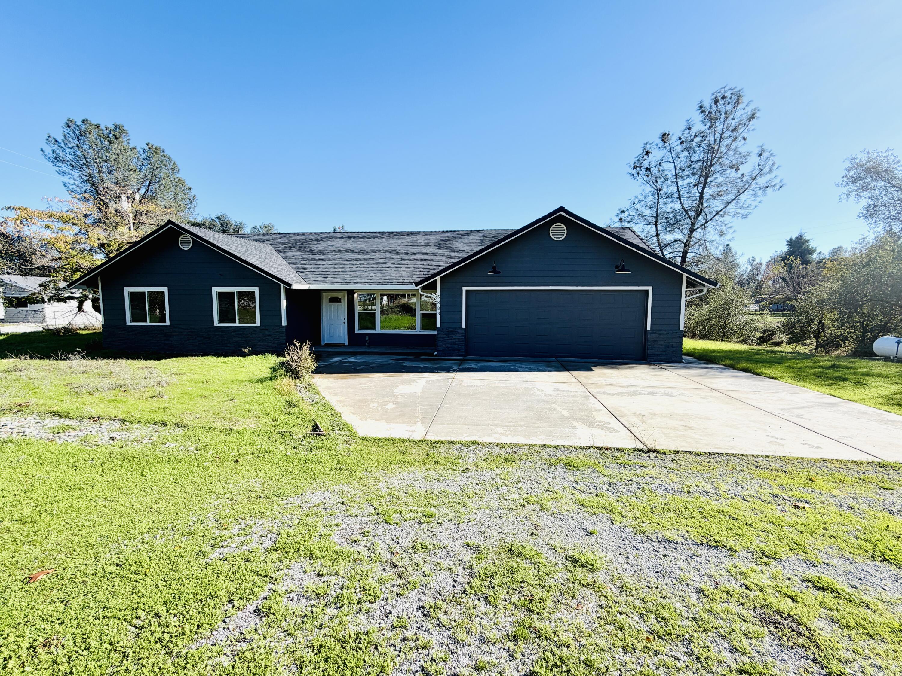5883 Happy Valley Road Anderson, CA 96007 - Photo 23 of 30 a view of a house with a yard