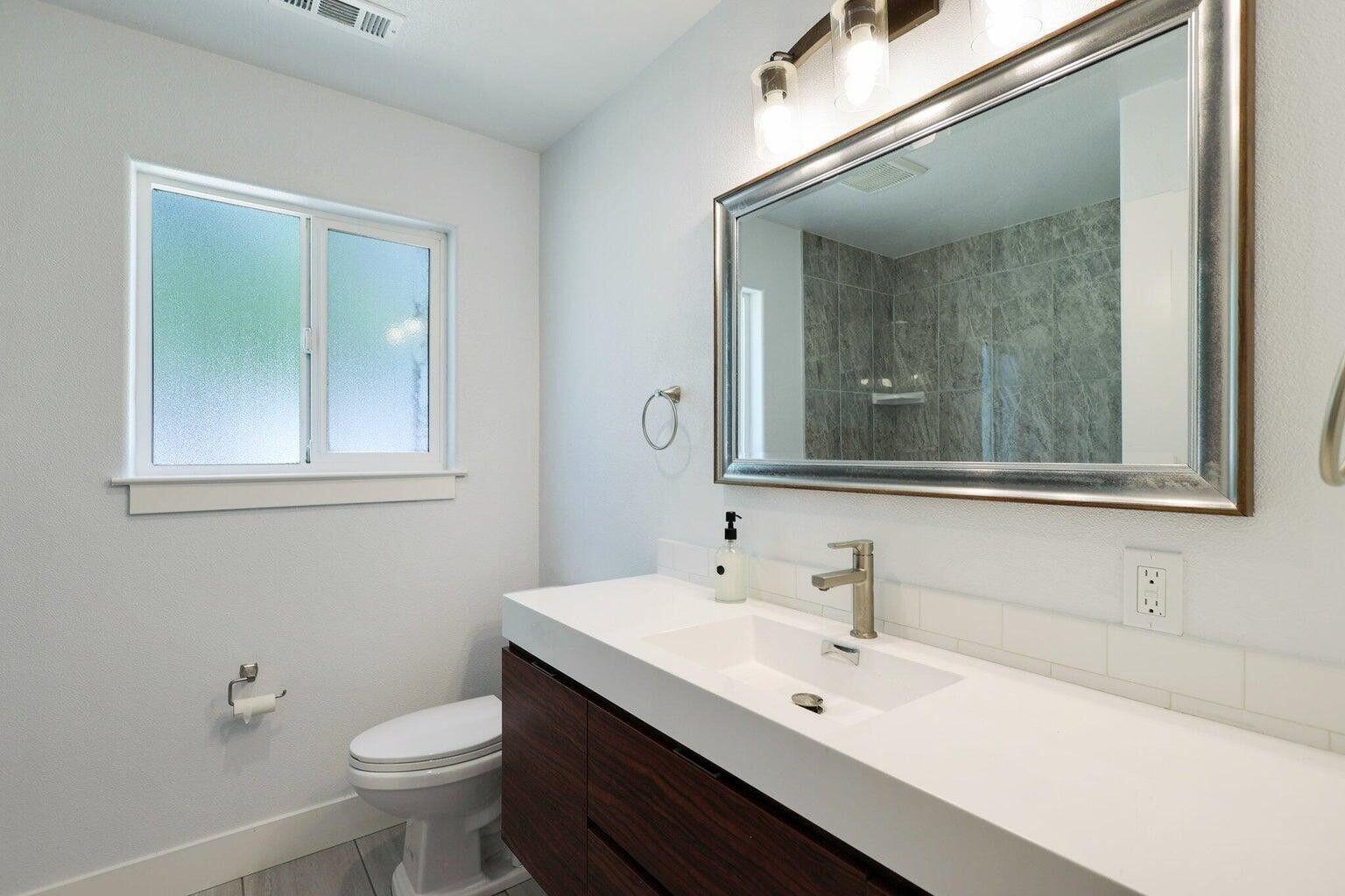 5883 Happy Valley Road Anderson, CA 96007 - Photo 4 of 30 a bathroom with a sink and a mirror