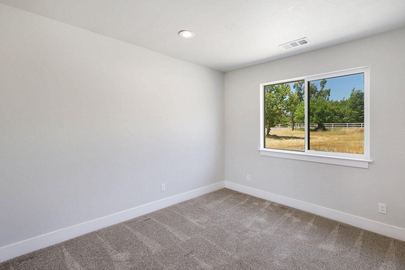 5883 Happy Valley Road Anderson, CA 96007 - Photo 5 of 30 an empty room with a window