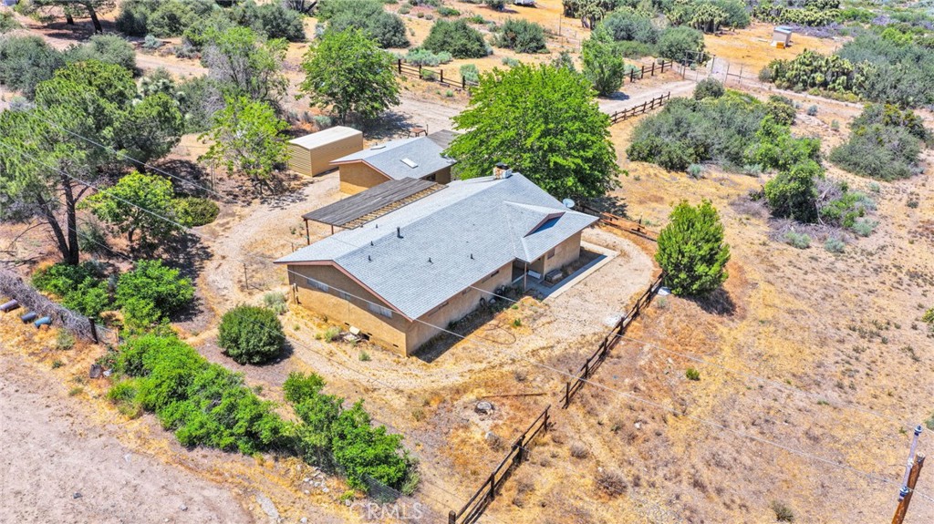 5500 Oil Well Road Phelan, CA 92371 - Photo 63 of 65 an aerial view of a house with a yard and lake view