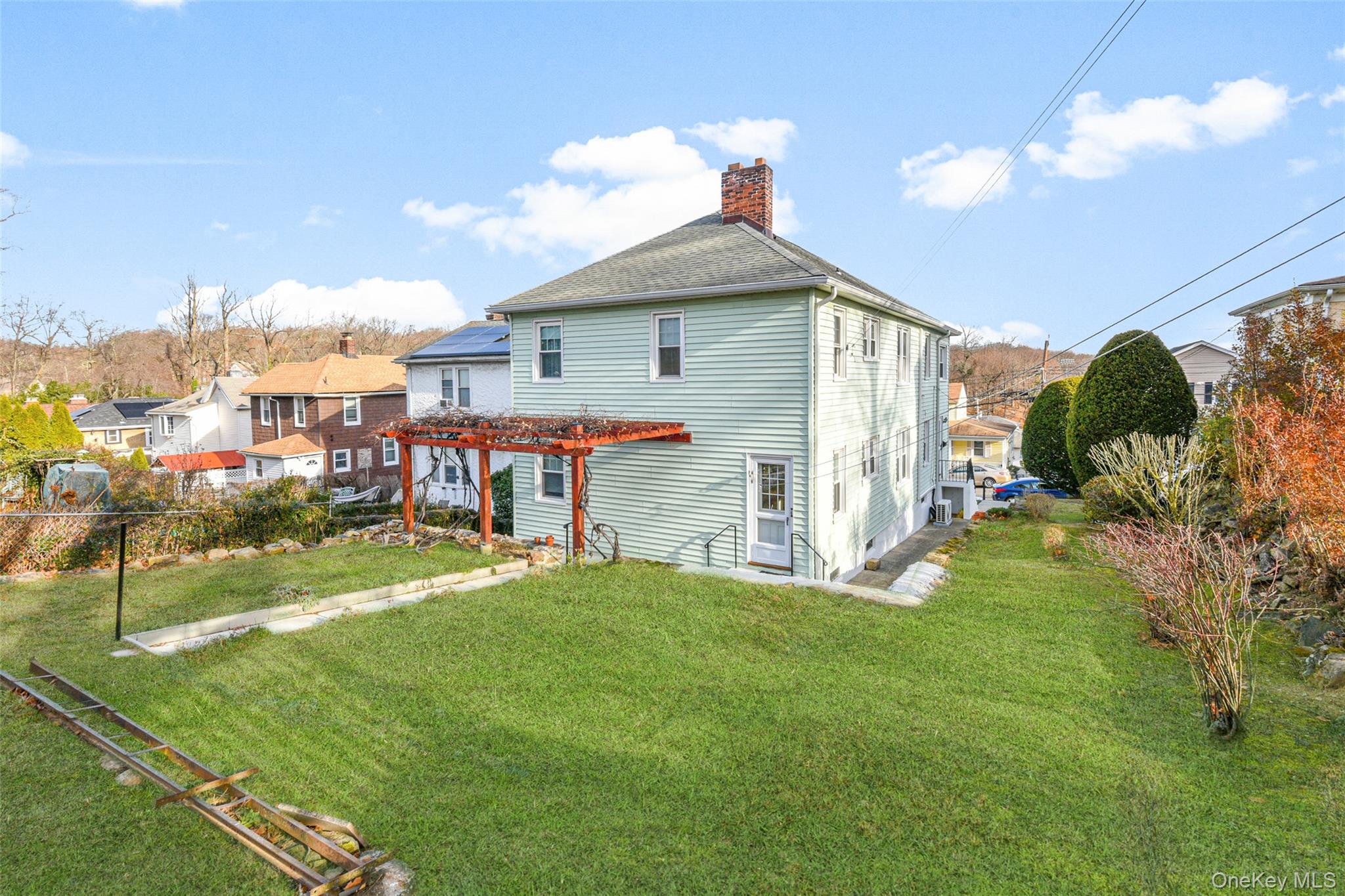 42 Crestview Street New Rochelle, NY 10801 - Photo 19 of 23 Rear view photo of yard with pergola