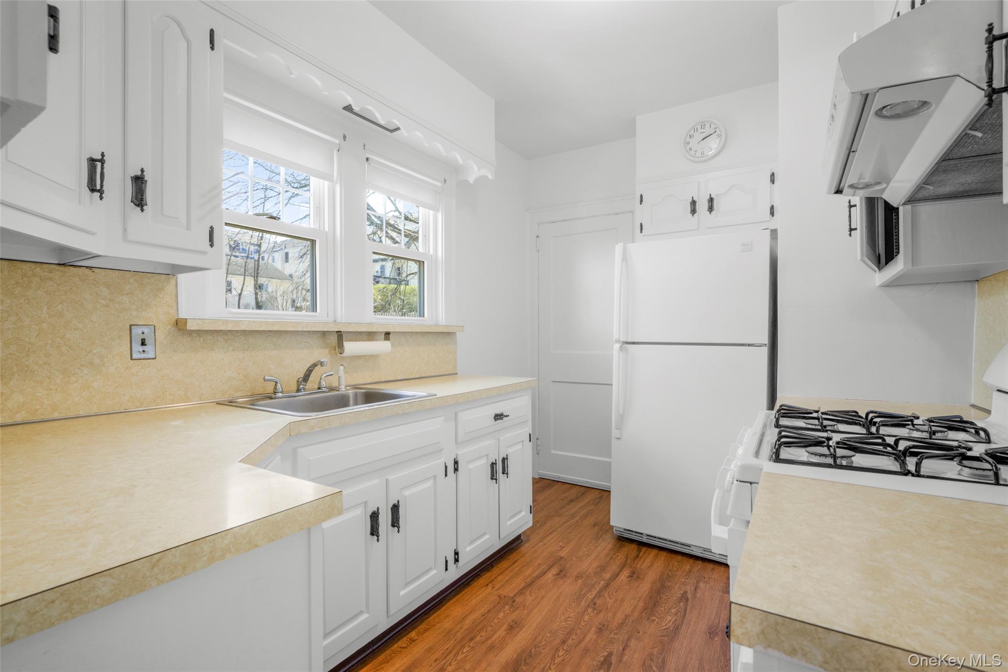 42 Crestview Street New Rochelle, NY 10801 - Photo 5 of 23 Kitchen has 2 windows over sink and a door which leads to rear staircase and basement