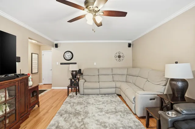 a bed room with a bed and a flat tv screen on a dresser
