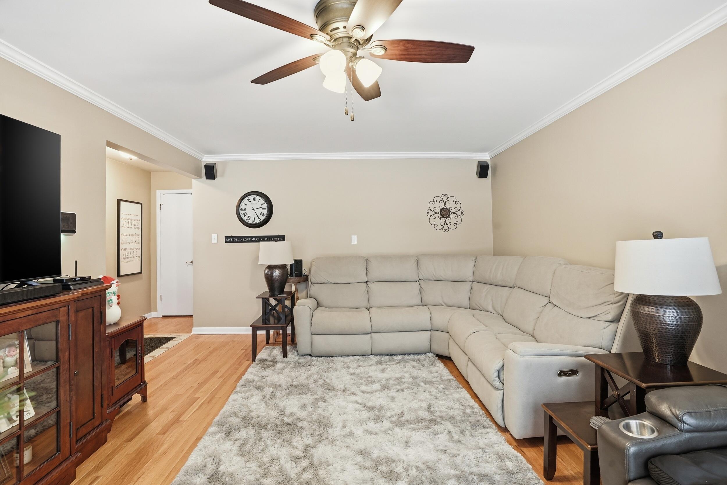 18 Timrick Drive Munster, IN 46321 - Photo 14 of 39 a bed room with a bed and a flat tv screen on a dresser
