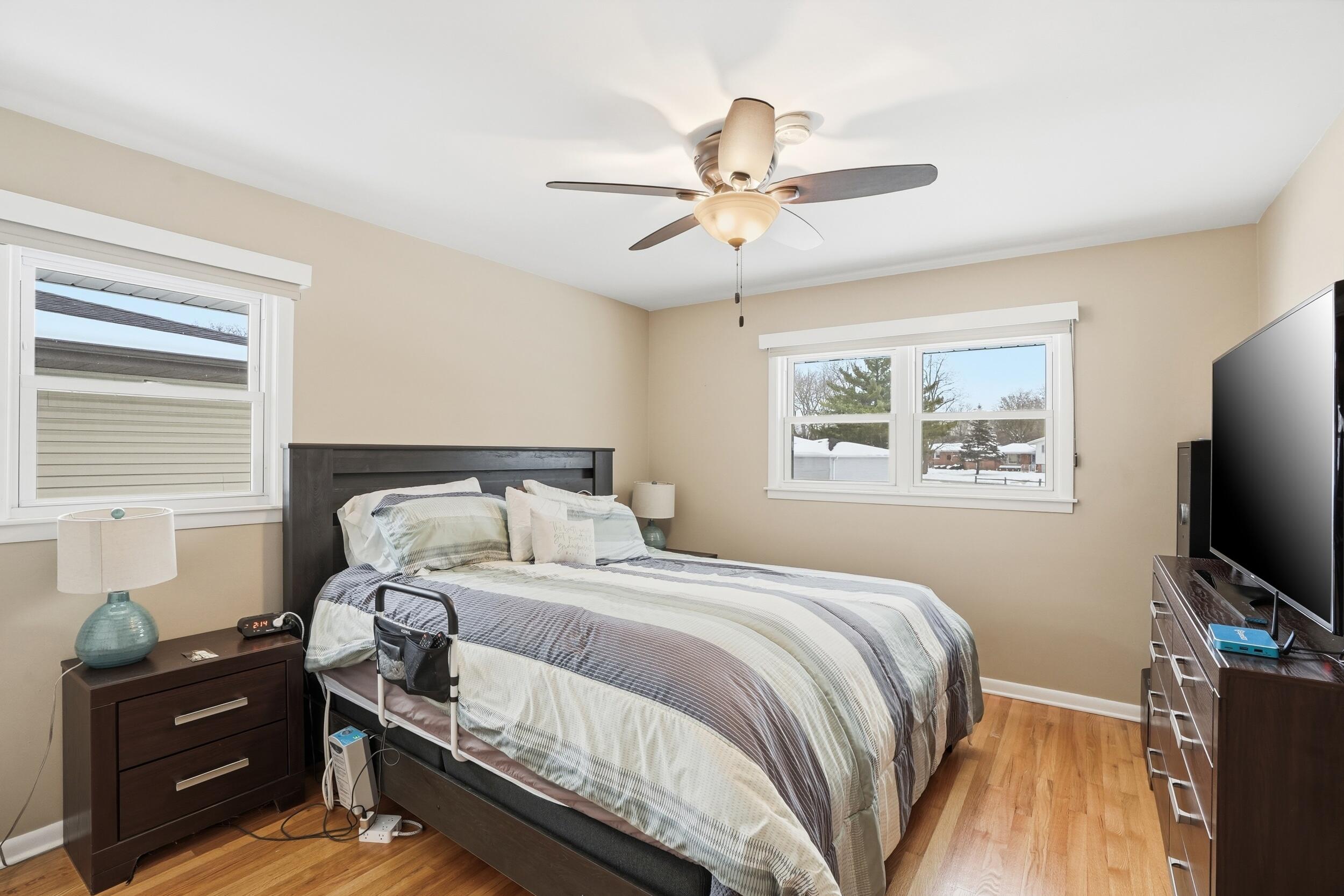 18 Timrick Drive Munster, IN 46321 - Photo 15 of 39 a bedroom with a bed and a flat screen tv